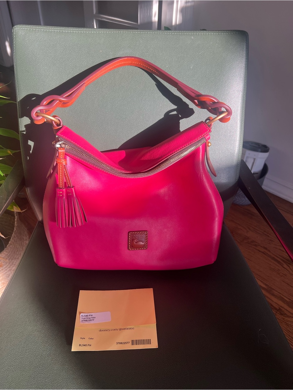 Dooney & Bourke Florentine twist strap hobo in fuschia